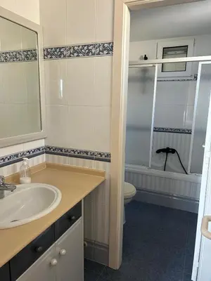 a bathroom with a sink and a toilet at Vila 