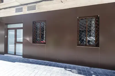 two windows on the side of a building at Arm Suites by Concept Flats in Valencia