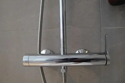 a metal shower head in a shower stall at Céntrico & Lujoso in Valencia