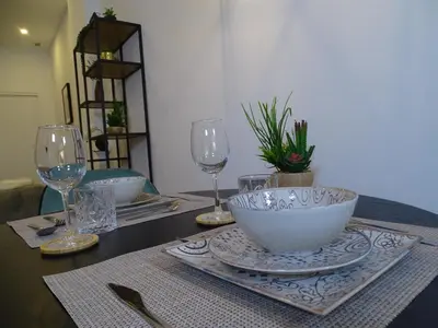 a dining room with a table and blue chairs at MDB 52A - Loft Valencia in Valencia