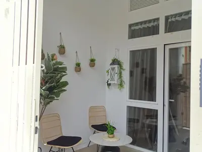 a patio with two chairs and a table with plants at MDB 52A - Loft Valencia in Valencia