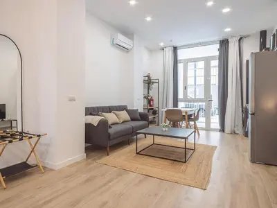 a living room with a couch and a table at Central Apartment in Benimaclet 2 in Valencia