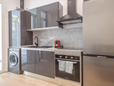a kitchen with a sink and a stove top oven at Central Apartment in Benimaclet 2 in Valencia