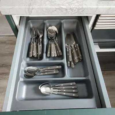 a sink with silver utensils in it at Piso A playa 19 in Puerto de Sagunto