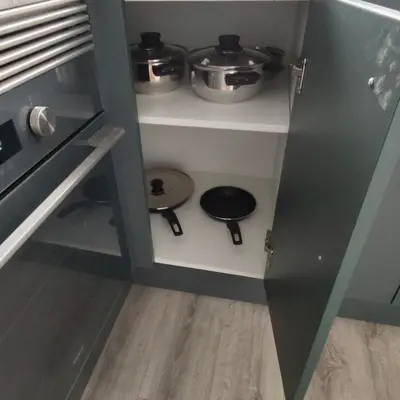 a kitchen with two pots and pans on shelves at Piso A playa 19 in Puerto de Sagunto