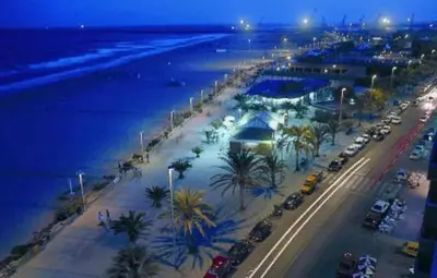 an aerial view of a beach with palm trees and cars at Lorea Puerto in Puerto de Sagunto