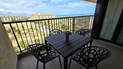 a black table and chairs on a balcony with a view at BEACH VALENCIA LUXURY D9-28 Apartment with terrace and sea views with two rooms in Valencia