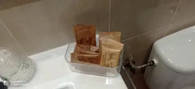 a box on the side of a toilet in a bathroom at Apartamento Cullera Playa in Cullera