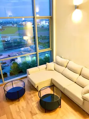 a living room with a white couch and a large window at Panoramic Suites II By VALENCIAFLATS EU in Valencia