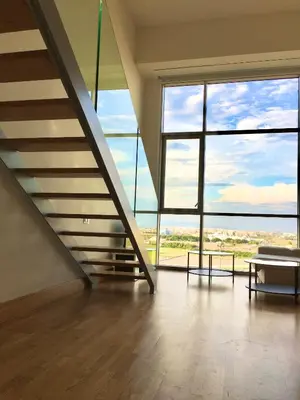 an empty room with a staircase and large windows at Panoramic Suites II By VALENCIAFLATS EU in Valencia