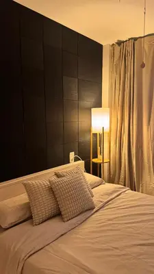 a bedroom with a large white bed with a lamp at Apartamento en Canet De Berenguer Playa - Valencia in Valencia