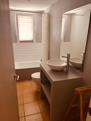a bathroom with a sink and a toilet and a mirror at Villa 20min Valencia - Playas in San Antonio de Banageber