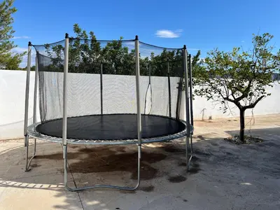 a metal trampoline in front of a fence at Villa 20min Valencia - Playas in San Antonio de Banageber