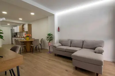 a living room with a couch and a table at Casa Pedro Cabanes in Valencia