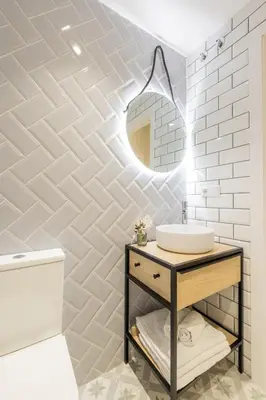 a bathroom with a sink and a mirror at Marina Arts Lofts in Valencia