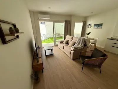 a living room with a couch and a table at Arenisca Zarco in Valencia