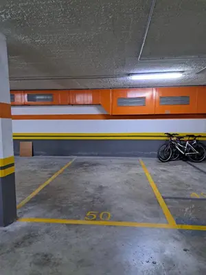 a bike is parked in a parking garage at kalma in Moncófar