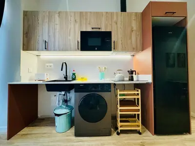 a kitchen with a washing machine and a sink at Modern Apartment with Style near Center in Valencia