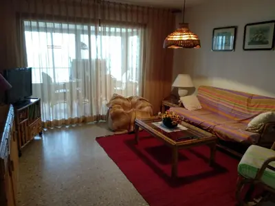 a living room with a couch and a coffee table at barlovento in Sueca