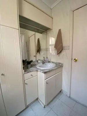 a bathroom with a sink and a mirror at Rincón Valenciano - Campanar in Valencia