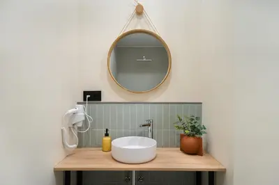 a bathroom with a white sink and a mirror at Apartments LEON GABRIEL MIRÓ in Valencia