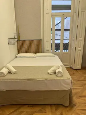 a bedroom with a bed with two towels on it at STAR Plaza España in Valencia