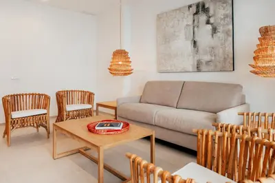 a living room with a couch and chairs at Valencia Living Suites in Picanya