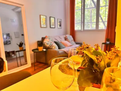 a living room with a table with wine glasses on it at Loft Llum Valencia in Valencia