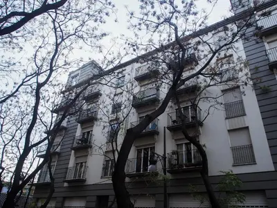 a white building with balconies and trees at SingularStays Na Jordana in Valencia