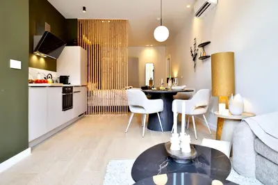 a kitchen and living room with a table and chairs at SariStays Valencia Finca Verde L in Valencia