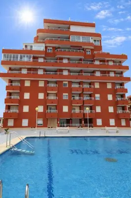 a swimming pool in front of a building at LAS LANZAS II - ATF Turisferr in Tavernes de Valldigna