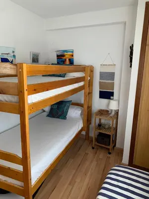 a bedroom with two bunk beds in a room at Fantásticas vistas al mar en el Faro in Faro de Cullera