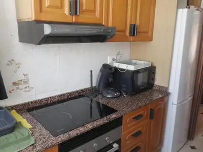 a kitchen with a sink and a microwave at El Raco, C-5-10 in Cullera