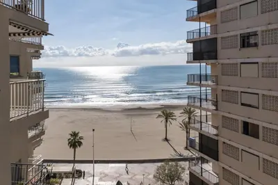 a view of the beach from the balcony of a building at El Raco, C-5-10 in Cullera