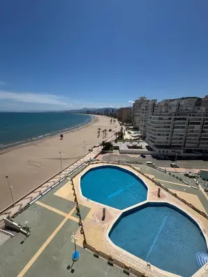 a view of a beach and two swimming pools at Résidence El Prado in Cullera