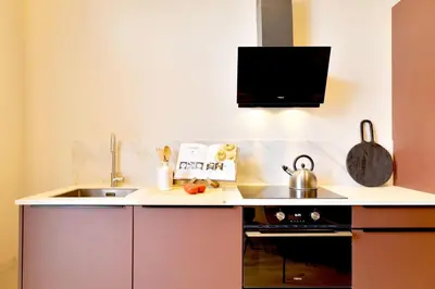 a small kitchen with a sink and a stove at SariStays Valencia City Center R in Valencia