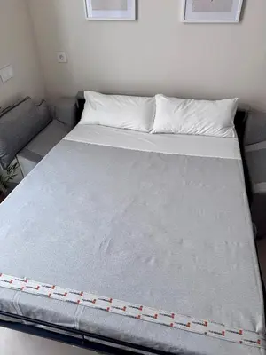 a large bed in a room with a couch at Apartamento Boutique Valencia 4-Pax - A-1 in Valencia