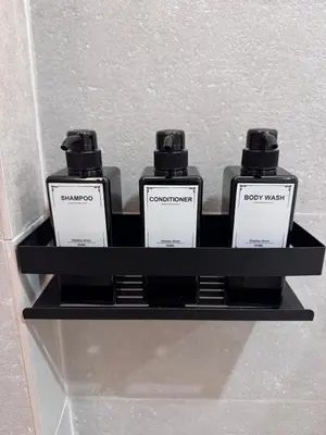 two bottles of soap on a shelf in a bathroom at Apartamento Boutique Valencia 4-Pax - A-1 in Valencia