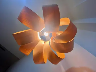 a wooden ceiling fan with a light on it at Duplex City of Arts & Science in Valencia