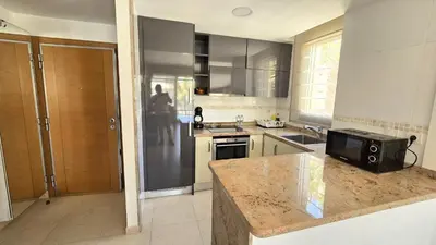 a kitchen with a counter with a microwave in it at BEACH VALENCIA LUXURY A36-22 Apartment with terrace and sea views in Valencia
