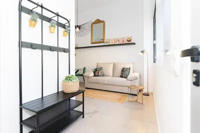 a living room with a couch and a table at Casa Ambrosia in Valencia