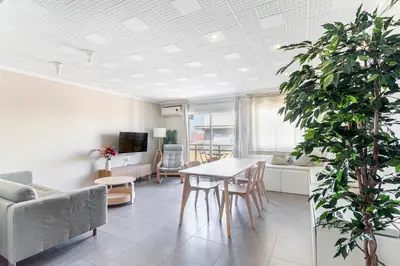 a bedroom with a bed with two candles on it at GuestReady - Your Relaxing Base in Valencia in Valencia