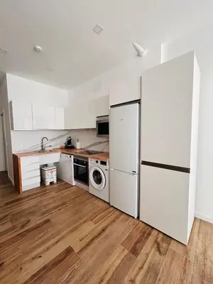 a kitchen with white appliances and a white refrigerator at Aires de Valencia in Valencia