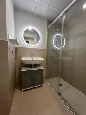 a bathroom with a sink and a shower at Luxury Canet in Canet de Berenguer