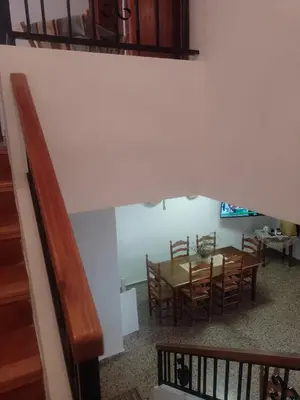 a dining room with a table and chairs at Casa Numari in Caudiel