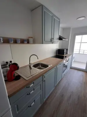 a kitchen with a sink and a counter top at Cullera Mar Azul in Cullera