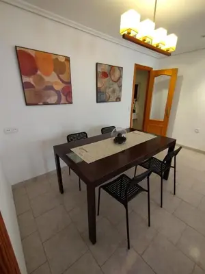 a dining room table and chairs in a room at valenia city in Valencia