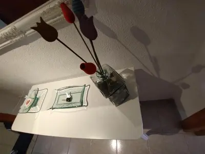 a white table with a vase on top of it at valenia city in Valencia
