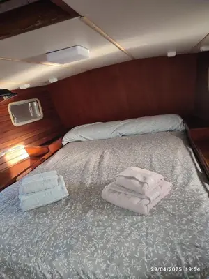 a bed in a boat with towels on it at Romantic sailboat in Valencia