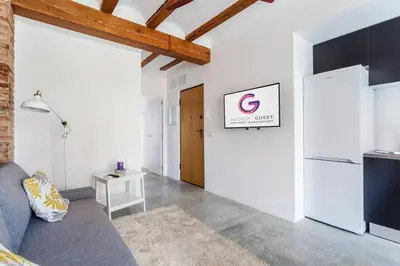 a living room with a couch and a refrigerator at Ruzafa Confort 3 pax wifi Denia 70 in Valencia